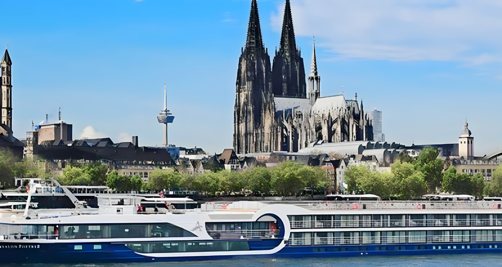 The ship moored beneath a riverside cathedral
